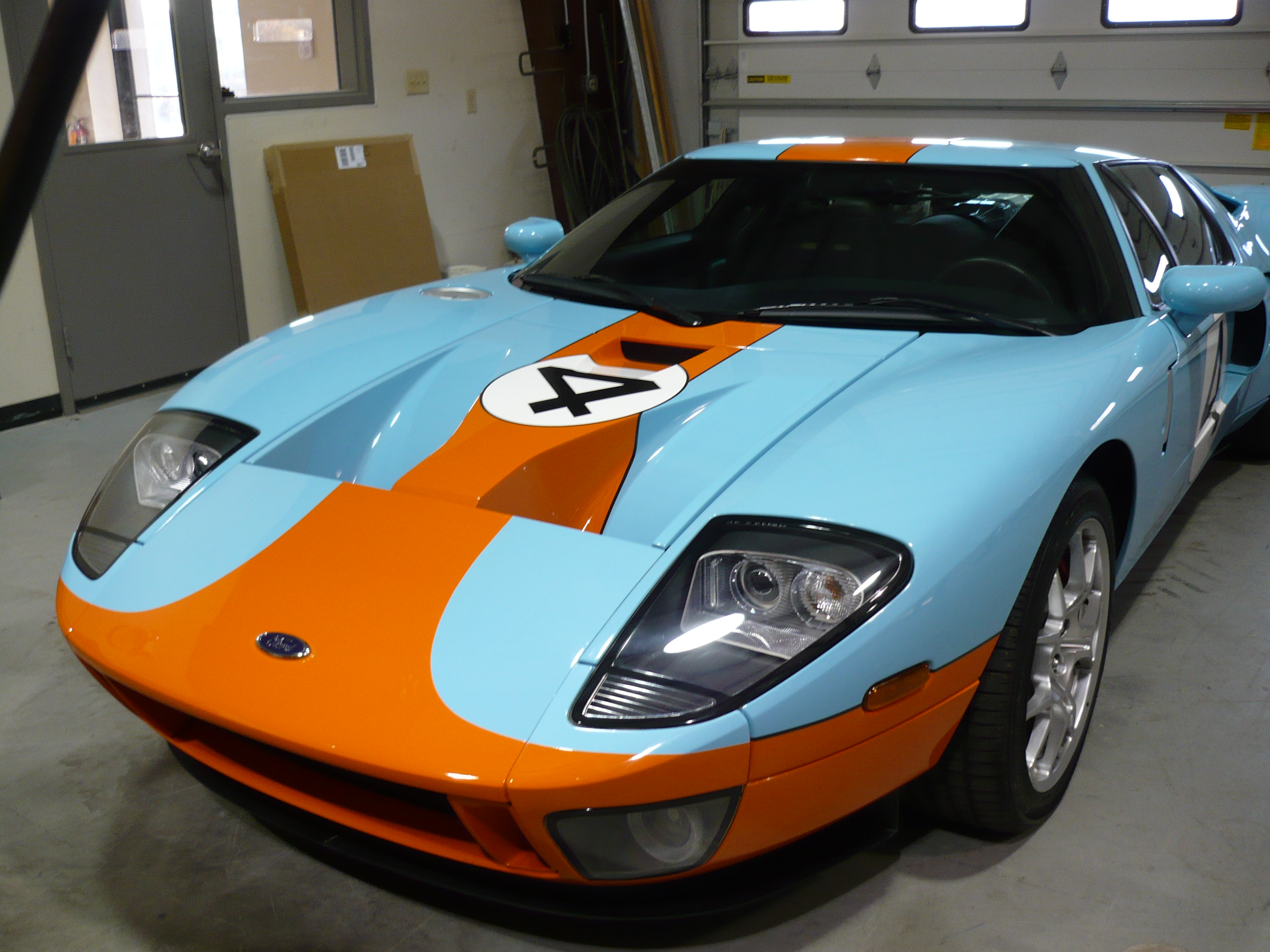 Bright Blue & Orange 2006 Ford GT Front View in Garage | Hagerstown Spring & Alignment