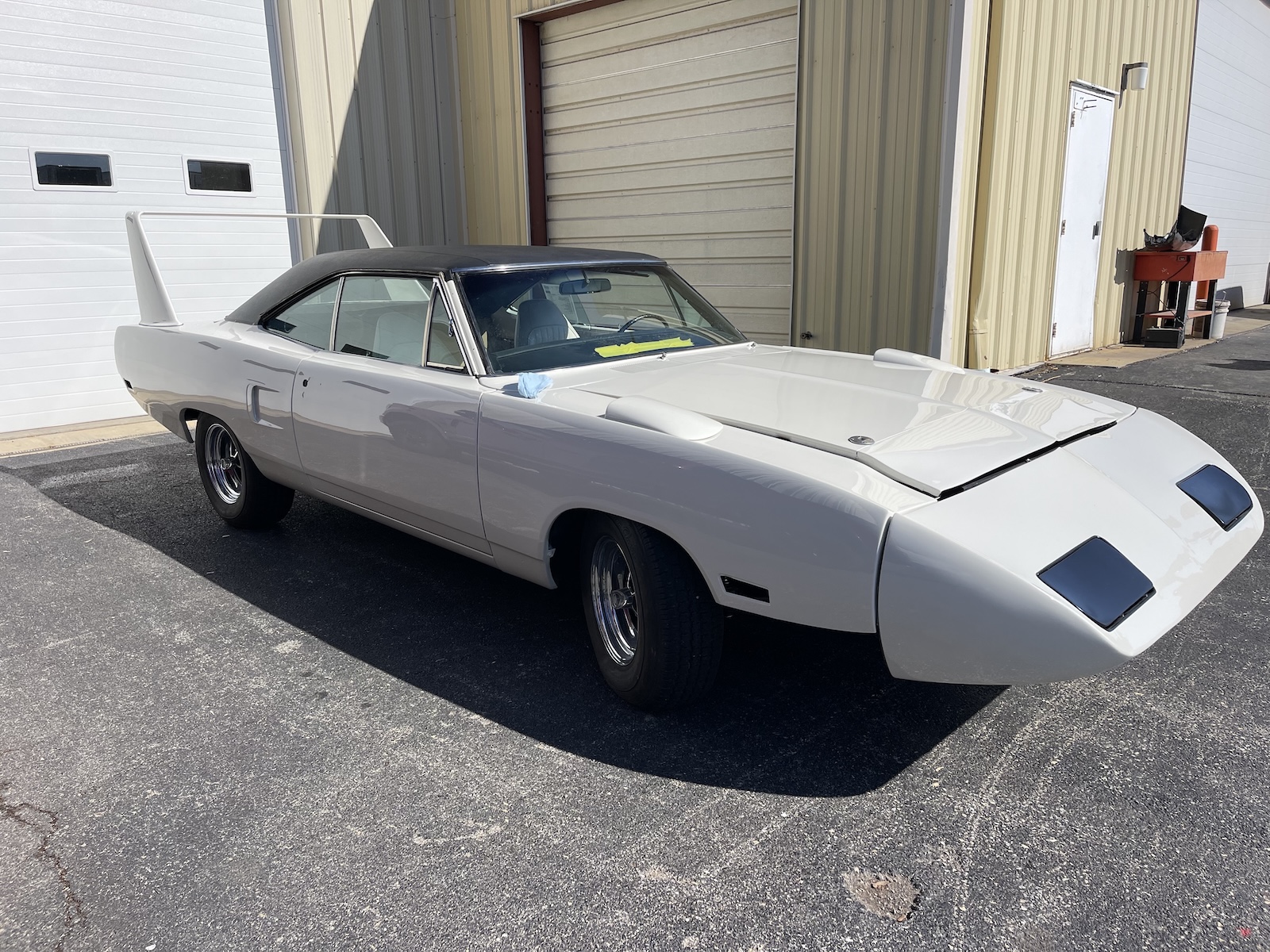 White Plymouth Road Runner Side Angle View in Front of Garage | Hagerstown Spring & Alignment